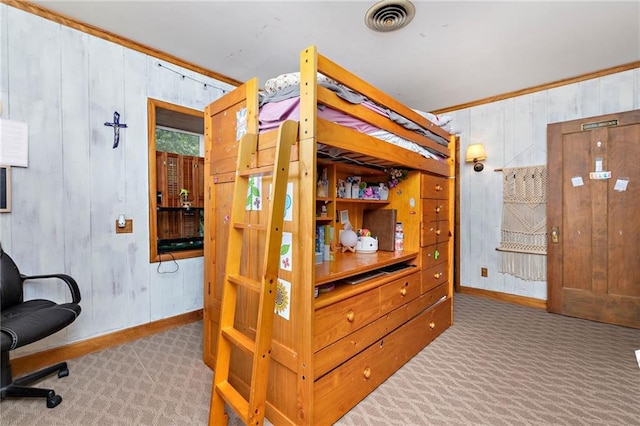 424 S Elm St, Ottawa, KS 66067 - bedroom featuring carpet flooring, wooden walls, and baseboards