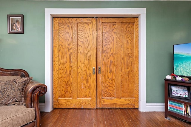 424 S Elm St, Ottawa, KS 66067 - bedroom featuring wood finished floors and baseboards