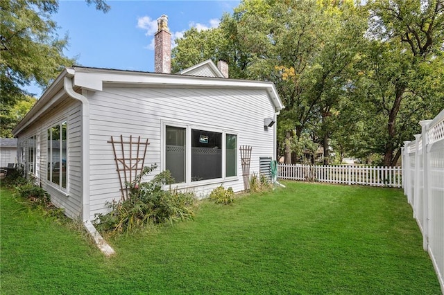 424 S Elm St, Ottawa, KS 66067 - view of side of property with a chimney