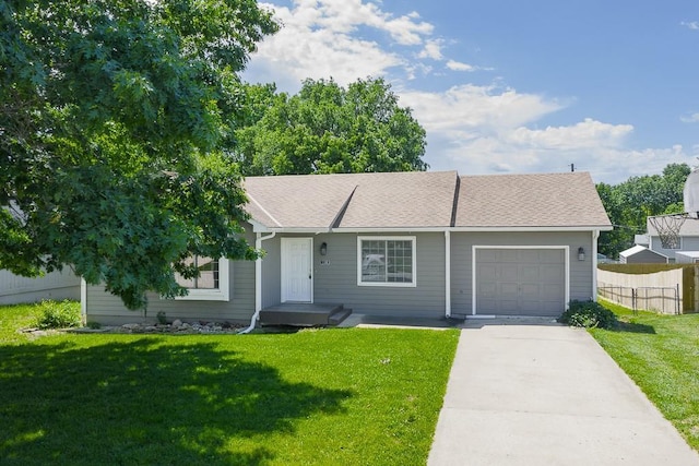 1180 Greenwood Pkwy, Tonganoxie, KS 66086 - view of front facade featuring an attached garage and concrete driveway