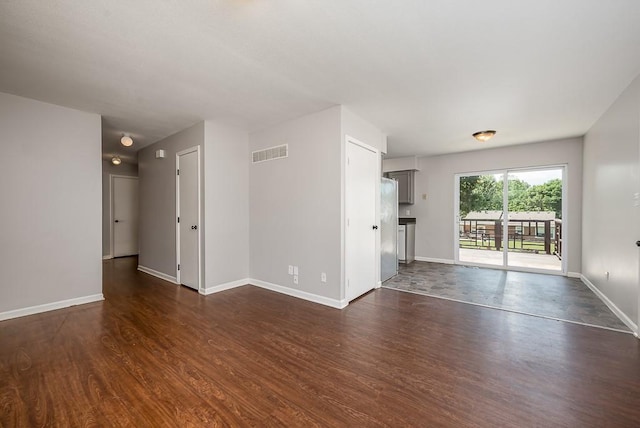 1180 Greenwood Pkwy, Tonganoxie, KS 66086 - spare room with dark wood finished floors and baseboards