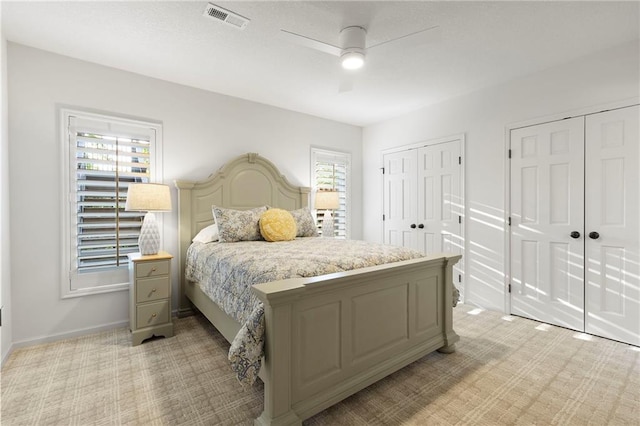 4424 NE Shadow Valley Cir, Lees Summit, MO 64064 - bedroom with light colored carpet, multiple closets, baseboards, and ceiling fan