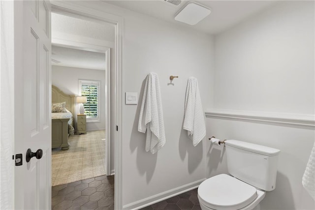 4424 NE Shadow Valley Cir, Lees Summit, MO 64064 - bathroom with toilet, tile patterned flooring, and baseboards
