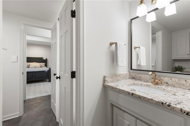 4424 NE Shadow Valley Cir, Lees Summit, MO 64064 - bathroom with vanity, ensuite bath, tile patterned flooring, and baseboards