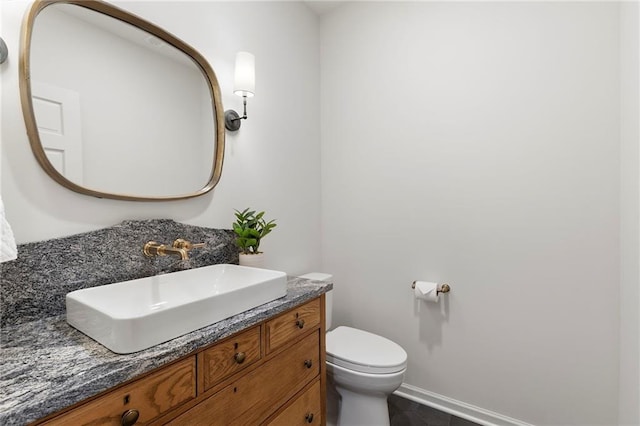 4424 NE Shadow Valley Cir, Lees Summit, MO 64064 - bathroom featuring toilet, vanity, tile patterned flooring, and baseboards