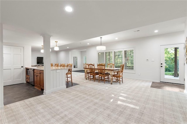 4424 NE Shadow Valley Cir, Lees Summit, MO 64064 - kitchen with a kitchen breakfast bar, recessed lighting, stainless steel dishwasher, baseboards, and hanging light fixtures