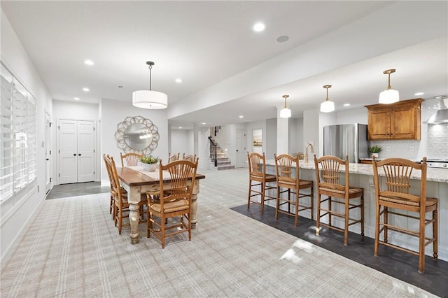 4424 NE Shadow Valley Cir, Lees Summit, MO 64064 - dining space with recessed lighting, stairs, light colored carpet, and baseboards