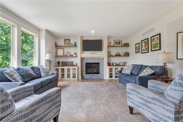 13897 W 140th St, Olathe, KS 66062 - living area featuring ornamental molding, wood finished floors, a glass covered fireplace, and recessed lighting
