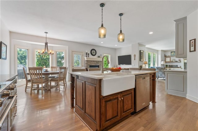 13897 W 140th St, Olathe, KS 66062 - kitchen with dishwasher, open floor plan, light wood finished floors, and recessed lighting