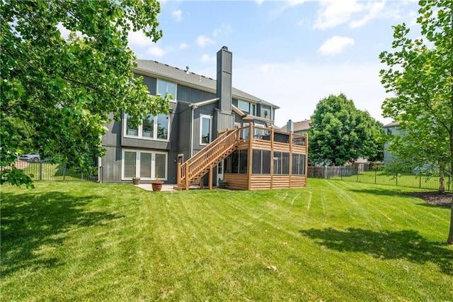 13897 W 140th St, Olathe, KS 66062 - rear view of property with stairway, a sunroom, a deck, and a chimney