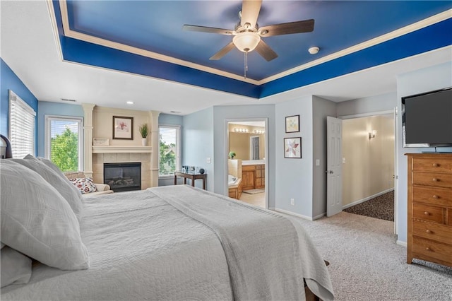 13897 W 140th St, Olathe, KS 66062 - bedroom featuring a raised ceiling, carpet floors, baseboards, a fireplace, and ensuite bathroom