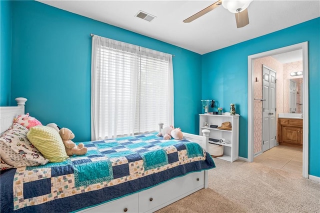 13897 W 140th St, Olathe, KS 66062 - bedroom with carpet, baseboards, ceiling fan, tile patterned flooring, and connected bathroom