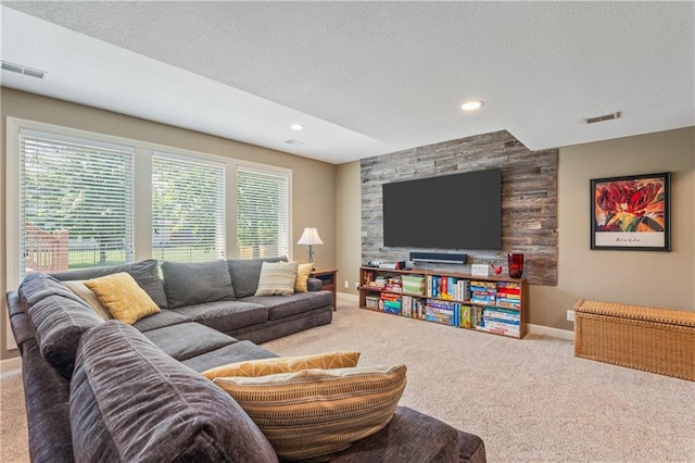 13897 W 140th St, Olathe, KS 66062 - carpeted living room with baseboards, a textured ceiling, and recessed lighting