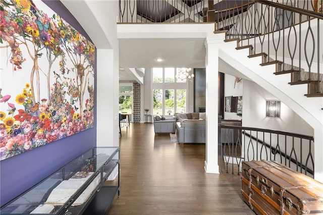 5947 N Cosby St, Kansas City, MO 64151 - entryway featuring wood finished floors, a towering ceiling, and stairway