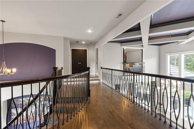 5947 N Cosby St, Kansas City, MO 64151 - corridor featuring a chandelier, wood finished floors, recessed lighting, beamed ceiling, and an upstairs landing