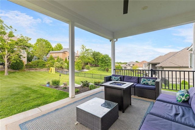 5947 N Cosby St, Kansas City, MO 64151 - view of patio / terrace with an outdoor living space with a fire pit, a playground, and a residential view
