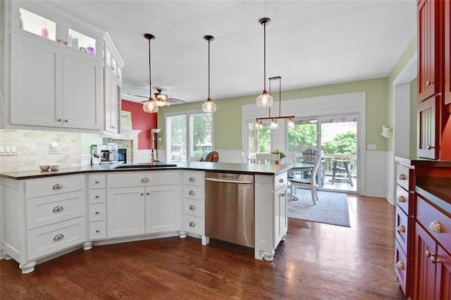 12712 W 126th St, Overland Park, KS 66213 - kitchen with dishwasher, dark countertops, a peninsula, ceiling fan, and dark wood-style floors