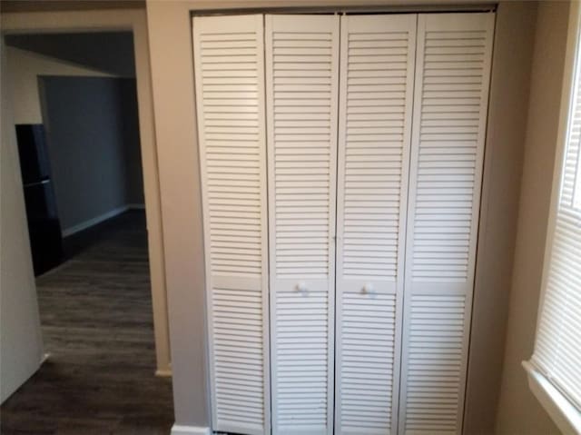 8828 N Main St, Kansas City, MO 64155 - detailed view of freestanding refrigerator and wood finished floors