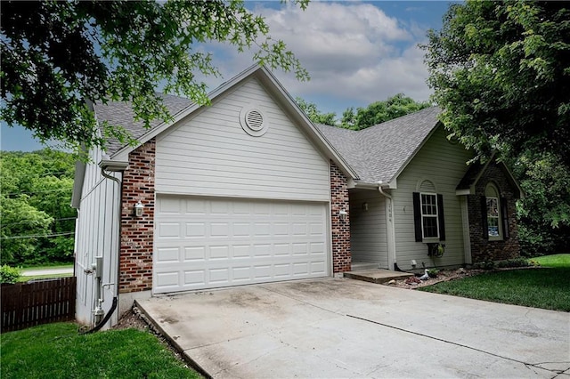 1604 S 105th Ter, Edwardsville, KS 66111 - single story home featuring a garage, roof with shingles, concrete driveway, and brick siding