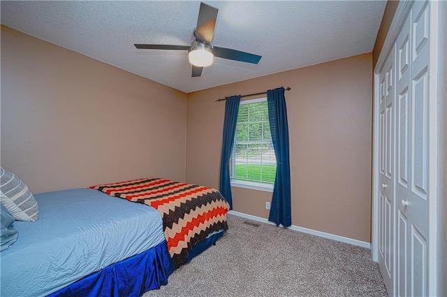 1604 S 105th Ter, Edwardsville, KS 66111 - bedroom with baseboards, carpet, a textured ceiling, and a ceiling fan
