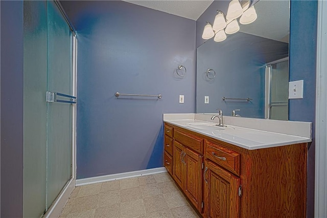 1604 S 105th Ter, Edwardsville, KS 66111 - full bath featuring baseboards, vanity, a stall shower, and tile patterned floors