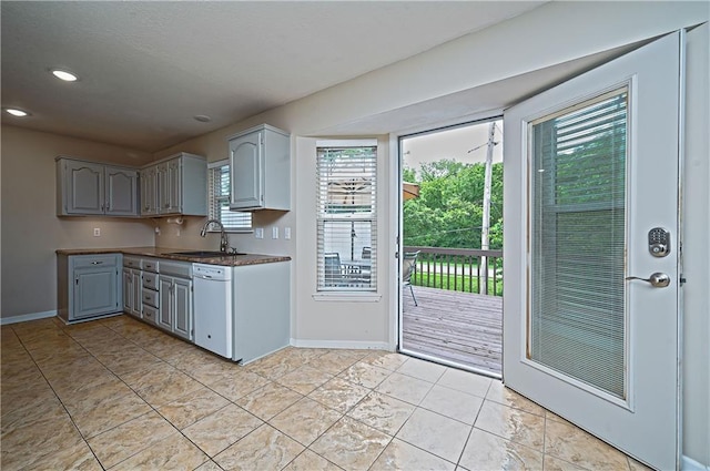 1604 S 105th Ter, Edwardsville, KS 66111 - kitchen with white dishwasher, a sink, gray cabinets, baseboards, and recessed lighting