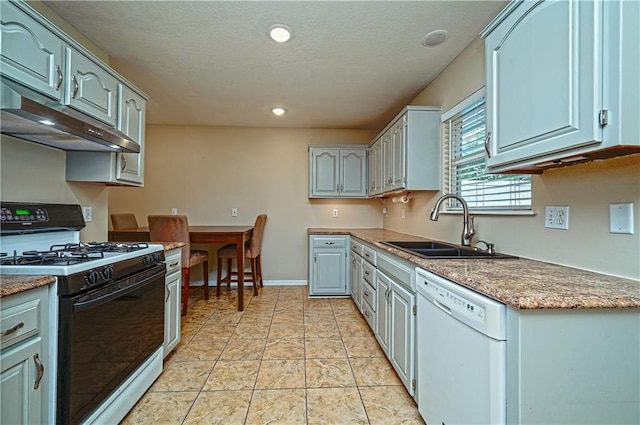 1604 S 105th Ter, Edwardsville, KS 66111 - kitchen featuring range with gas cooktop, dishwasher, a sink, under cabinet range hood, and baseboards