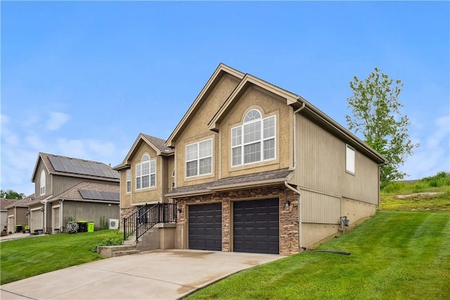 19708 E 11th Ter N, Independence, MO 64056 - townhome / multi-family property with a front lawn, a garage, and driveway
