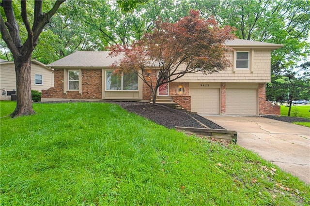 9425 Carter Dr, Overland Park, KS 66212 - tri-level home featuring concrete driveway, an attached garage, a front yard, and brick siding