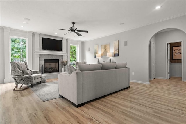 11412 S Lakecrest Dr, Olathe, KS 66061 - living room featuring plenty of natural light, a ceiling fan, arched walkways, baseboards, and recessed lighting