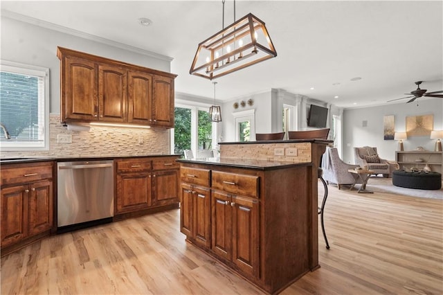 11412 S Lakecrest Dr, Olathe, KS 66061 - kitchen featuring dishwasher, light wood-type flooring, a kitchen breakfast bar, dark countertops, and recessed lighting