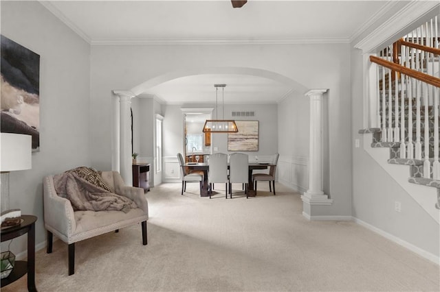 11412 S Lakecrest Dr, Olathe, KS 66061 - carpeted dining room with arched walkways, ornate columns, ornamental molding, and stairs