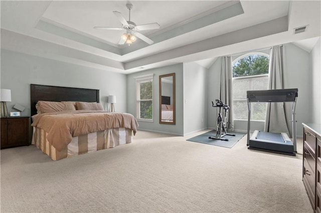 11412 S Lakecrest Dr, Olathe, KS 66061 - bedroom featuring a tray ceiling, light carpet, baseboards, and ceiling fan
