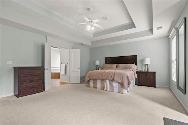 11412 S Lakecrest Dr, Olathe, KS 66061 - bedroom featuring carpet floors, baseboards, a tray ceiling, and ensuite bath