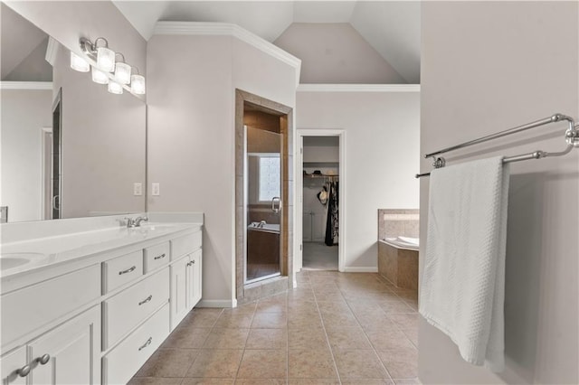 11412 S Lakecrest Dr, Olathe, KS 66061 - full bath featuring double vanity, a garden tub, a spacious closet, lofted ceiling, and tile patterned flooring