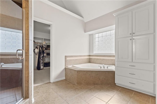 11412 S Lakecrest Dr, Olathe, KS 66061 - bathroom with tile patterned floors, a bath, a stall shower, a spacious closet, and crown molding