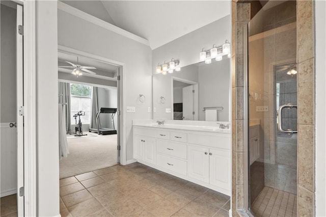 11412 S Lakecrest Dr, Olathe, KS 66061 - bathroom with double vanity, a stall shower, ceiling fan, tile patterned flooring, and ornamental molding