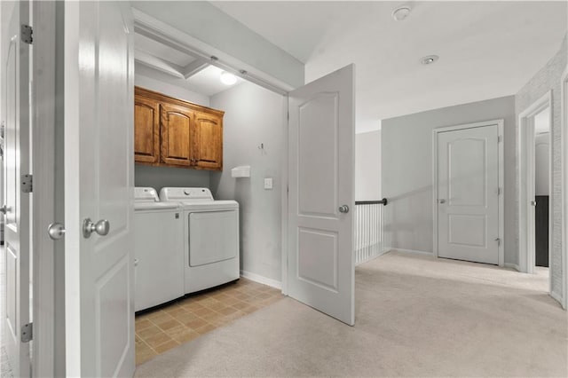 11412 S Lakecrest Dr, Olathe, KS 66061 - washroom featuring cabinet space, washer and clothes dryer, light carpet, and baseboards