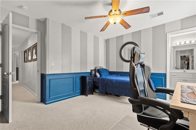11412 S Lakecrest Dr, Olathe, KS 66061 - bedroom with light colored carpet, a wainscoted wall, a ceiling fan, and a decorative wall