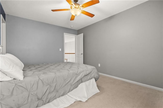 11412 S Lakecrest Dr, Olathe, KS 66061 - carpeted bedroom with ceiling fan and baseboards
