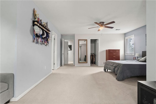 11412 S Lakecrest Dr, Olathe, KS 66061 - bedroom featuring light colored carpet, a spacious closet, baseboards, ceiling fan, and a closet