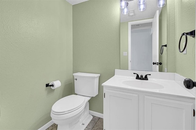 1413 SE Norwood Dr, Lees Summit, MO 64081 - half bath featuring toilet, a textured wall, baseboards, vanity, and tile patterned floors