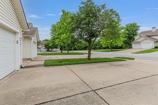 1413 SE Norwood Dr, Lees Summit, MO 64081 - view of yard with a garage