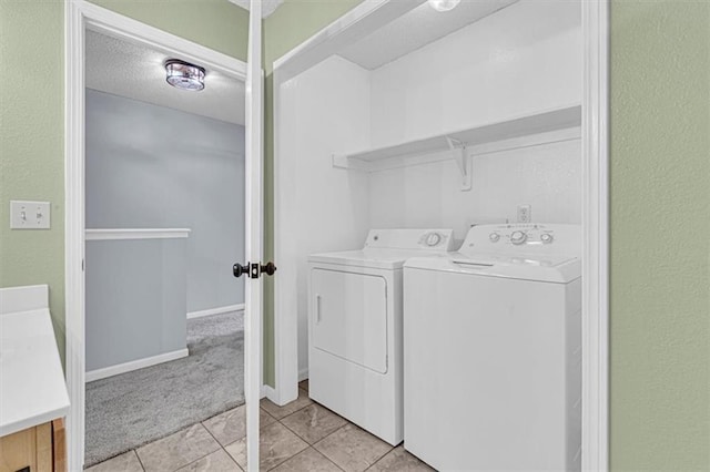 1413 SE Norwood Dr, Lees Summit, MO 64081 - laundry room with independent washer and dryer, light tile patterned floors, light carpet, baseboards, and a textured wall