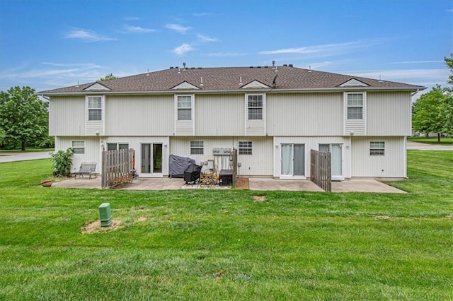 1413 SE Norwood Dr, Lees Summit, MO 64081 - back of property with a patio area and a yard