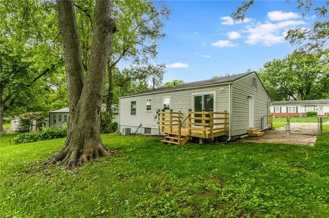 704 W 38th St N, Independence, MO 64052 - rear view of house featuring a gate, a wooden deck, and central AC unit