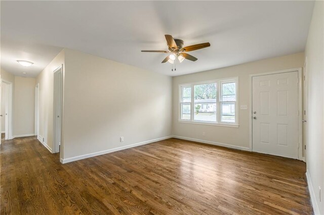 704 W 38th St N, Independence, MO 64052 - entryway with a ceiling fan, dark wood-style floors, and baseboards