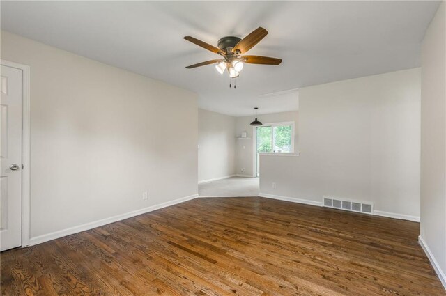 704 W 38th St N, Independence, MO 64052 - unfurnished room with a ceiling fan, wood finished floors, and baseboards