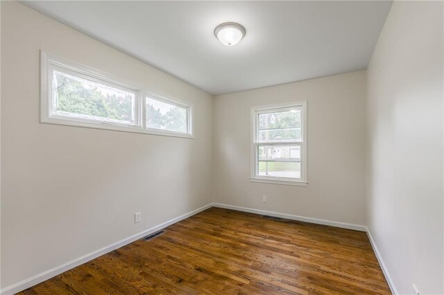 704 W 38th St N, Independence, MO 64052 - empty room with baseboards and dark wood finished floors