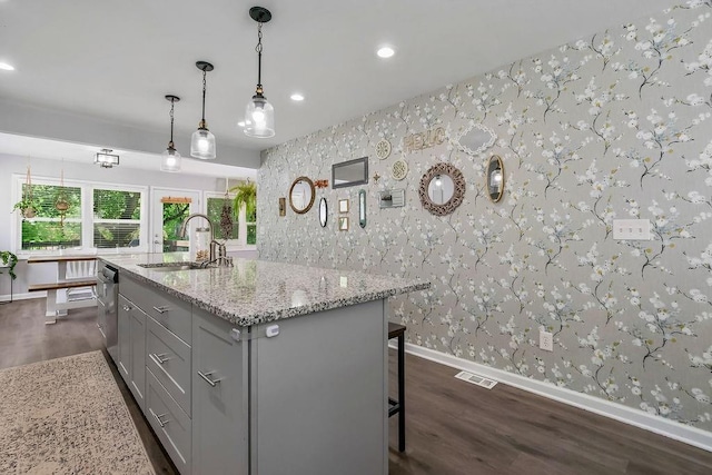 920 S Washington St, Independence, MO 64050 - kitchen with wallpapered walls, a sink, baseboards, gray cabinets, and dark wood-style flooring